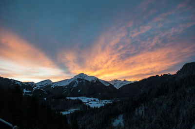 Scenic view of mountains against sky during sunset