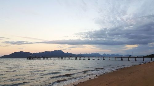Scenic view of beach against sky during sunset
