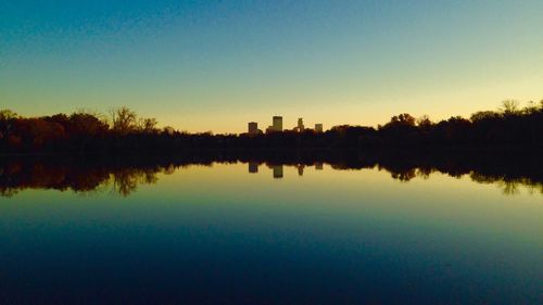 Reflection of trees in calm lake