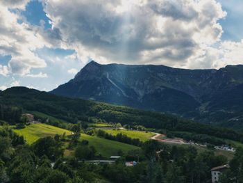 Scenic view of landscape and mountains against sky