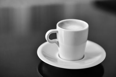 Close-up of coffee cup on table