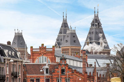 Low angle view of buildings against sky in city