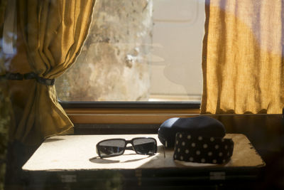 Close-up of sunglasses on table at home