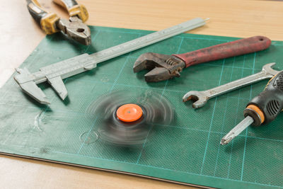 High angle view of work tools on wood