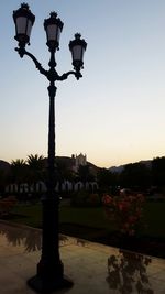 Street light against sky at sunset