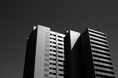 Low angle view of modern buildings against clear sky