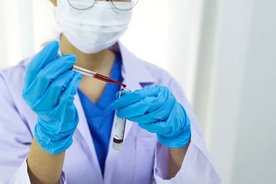 Dentist examining patient in clinic