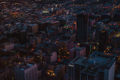 High angle view of city lit up at night