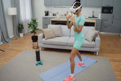 Low section of woman exercising in gym