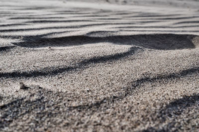 High angle view of shadow on sand