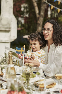 Portrait of mother and son on table