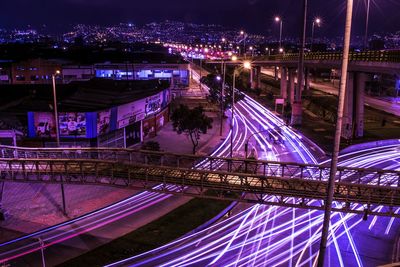 High angle view of light trails on road in city