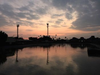 Reflection of clouds in sea at dusk