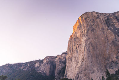 Scenic view of rocky mountains against clear sky