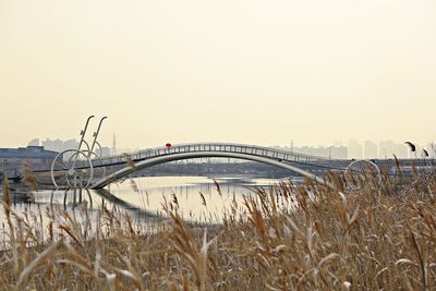 View of bridge over river against clear sky