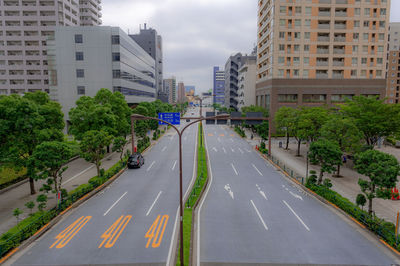 Road amidst buildings in city