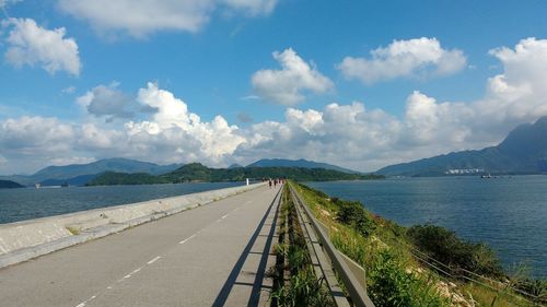 High angle view of road by sea against sky