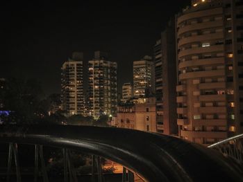 Illuminated buildings in city at night