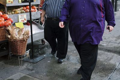 Full length of man standing in shopping mall