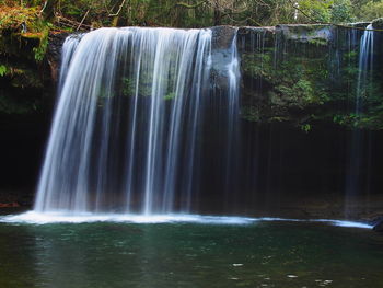 View of waterfall in forest