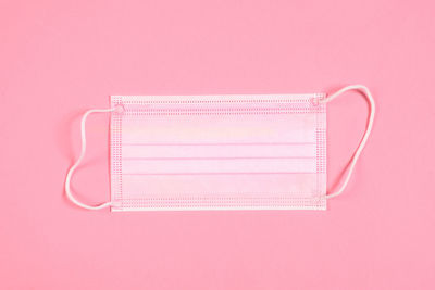 High angle view of pink umbrella on table