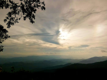 Scenic view of silhouette mountains against sky at sunset