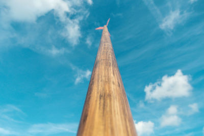 Low angle view of cross against blue sky