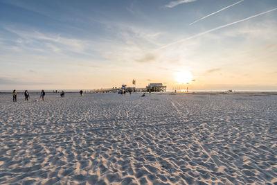 Scenic view of beach against sky during sunset