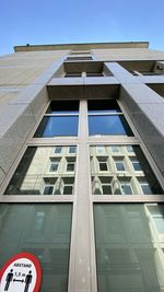 Low angle view of building against blue sky