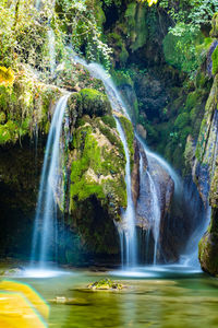 Long exposure image of waterfall in forest