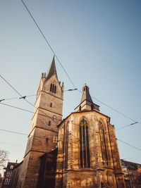 Low angle view of old church against clear sky