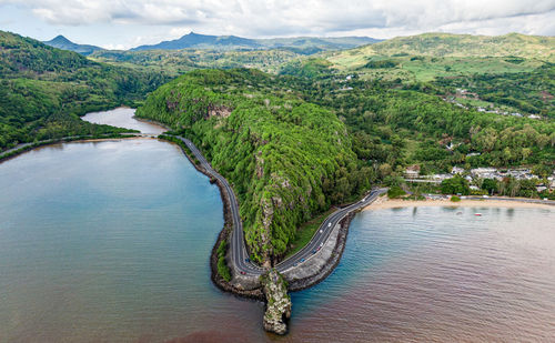 Scenic view of river amidst mountains against sky