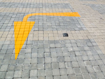 High angle view of yellow road sign