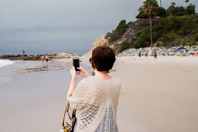 Rear view of woman on beach