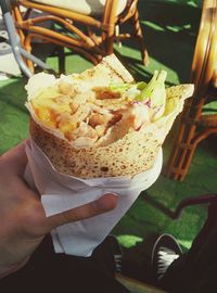 Cropped image of hand holding ice cream