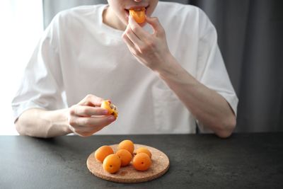 Midsection of man preparing food