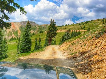 Scenic view of landscape against cloudy sky