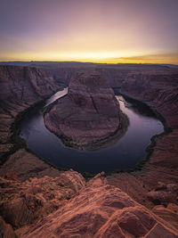 Aerial view of rock formations against sky during sunset