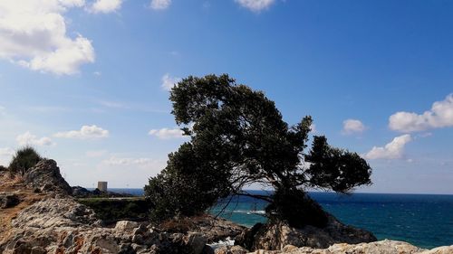 Scenic view of sea against cloudy sky