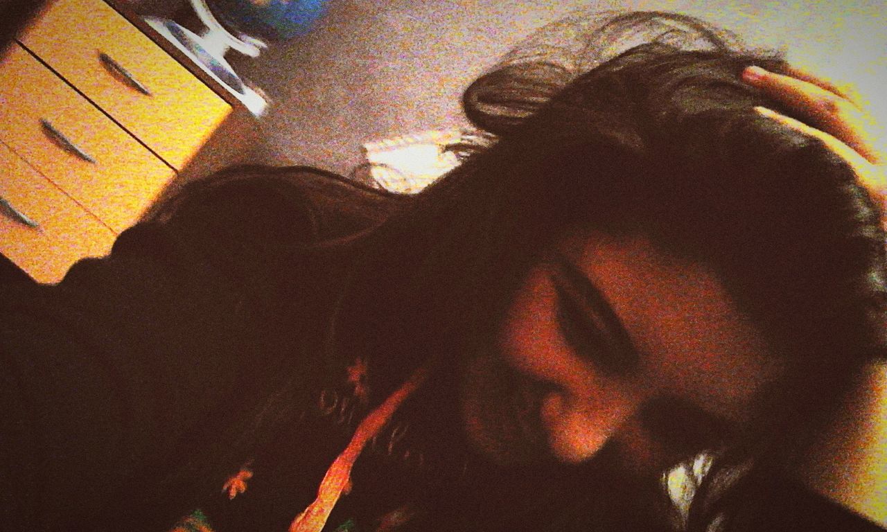 lifestyles, leisure activity, indoors, young adult, architecture, young women, high angle view, headshot, shadow, wall - building feature, built structure, person, men, casual clothing, building exterior, standing, three quarter length