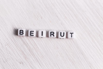 Close-up of text on wooden wall