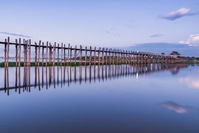 Pier over lake against sky