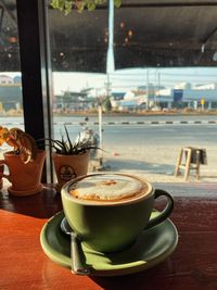 Coffee cup on table at restaurant