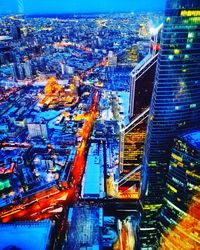 Aerial view of illuminated cityscape at night