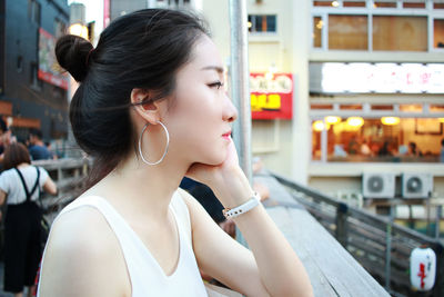 Young woman looking at city