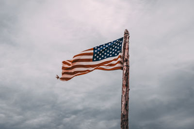 Low angle view of flag against sky