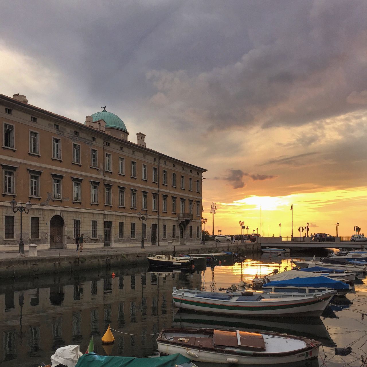 sky, sunset, nautical vessel, water, cloud - sky, moored, building exterior, transportation, mode of transport, architecture, built structure, boat, cloudy, sea, cloud, weather, orange color, harbor, outdoors, nature