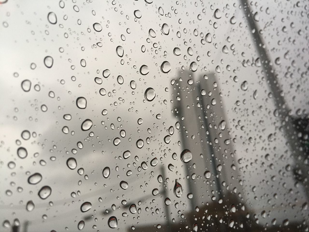 FULL FRAME SHOT OF WET WINDOW IN RAINY SEASON