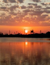 Scenic view of silhouette bridge against sky during sunset