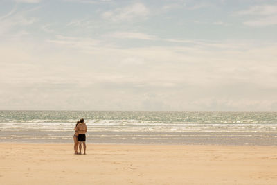 Couple on a beach in france in brittany in summer